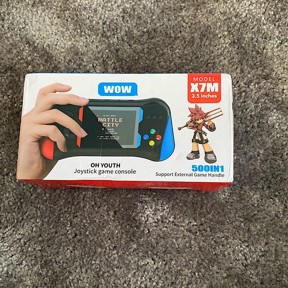 Handheld joystick games console from HIJJJPS. It’s the model X7M, red and blue.